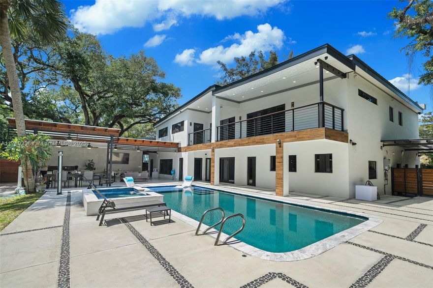 Modern new-construction estate blending high-end luxury and smart functionality on a 17,915 sqft lot. 5,235 sqft of open-concept design with floor-to-ceiling windows, soaring ceilings, and premium finishes. Chef’s kitchen, private home theater, covered patio with full BBQ station, and oversized pool with jacuzzi—perfect for entertaining. Features a private bunker, large storage container, and secured space for 15+ cars, RVs, boats, and jetskis behind 4 gated entrances. All bedrooms offer spa-style bathrooms and large walk-in closets. Elevated lot—no flood zone. No HOA. Built with top-tier materials, cutting-edge smart home technology, and unmatched attention to design, comfort, and detail.