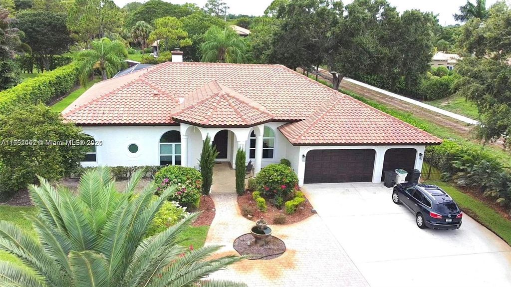 Photo of 6963 NW 66th Ave, Parkland, FL 33067 (MLS # A11751442)
