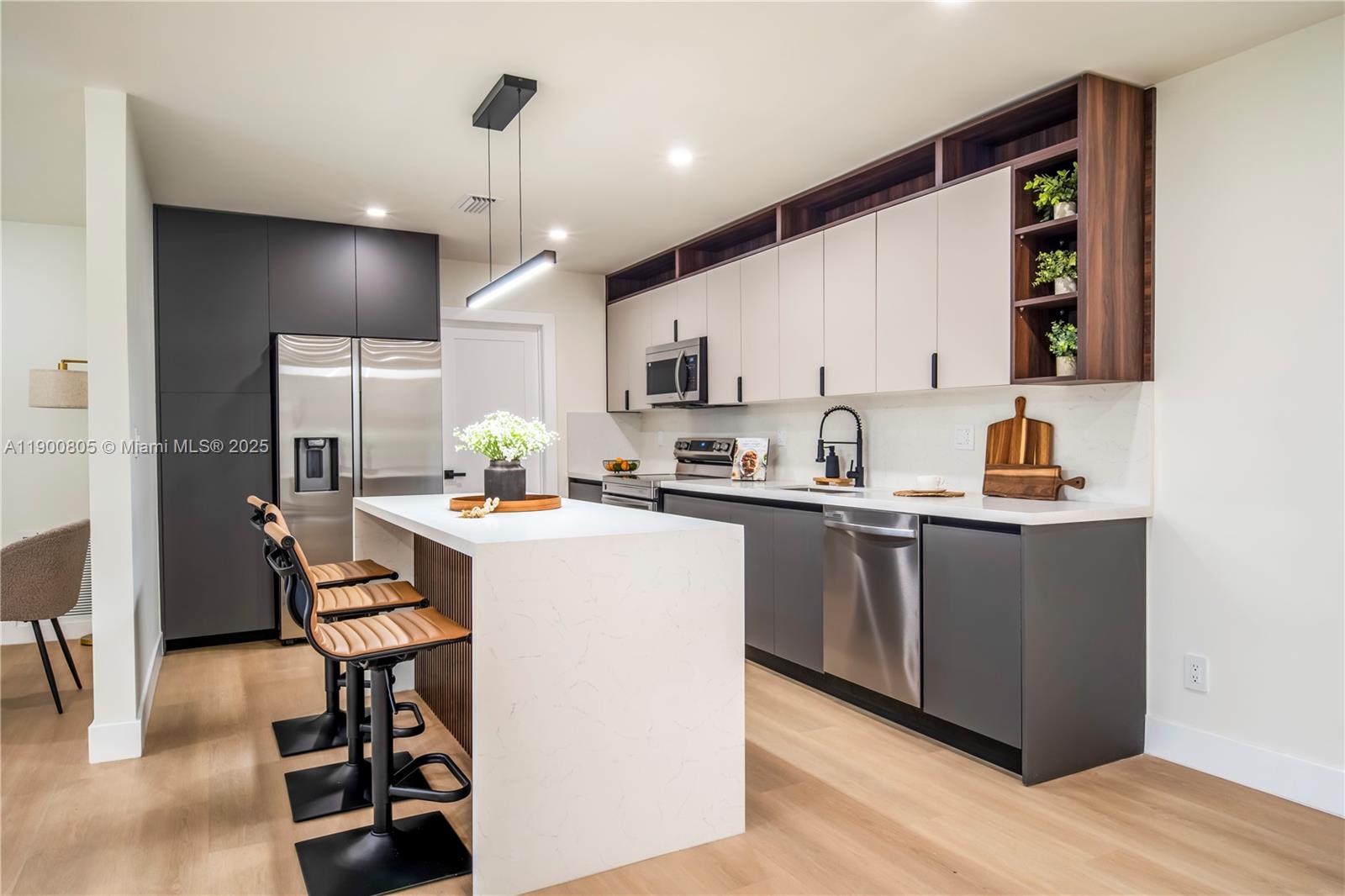 Perfectly located single-family home on a quiet street, set on a large corner lot with a sparkling pool. This stunning 3-bedroom, 2-bath residence also features a spacious den/office, ideal for working from home or as an extra living area.Enjoy a bright open layout with high ceilings, abundant natural light, and modern finishes throughout. Recent upgrades include new vinyl flooring, impact windows, updated bathrooms, and a modern kitchen with new countertops and appliances.