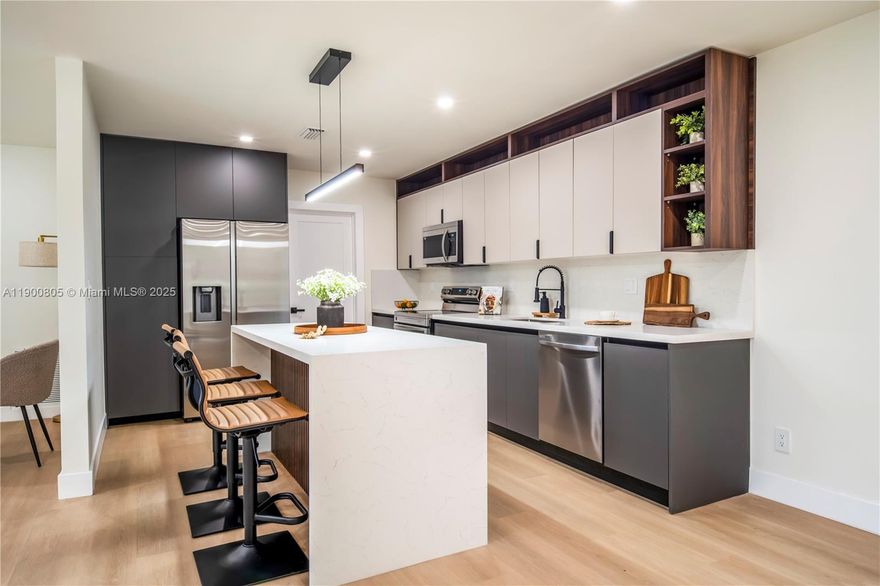 Perfectly located single-family home on a quiet street, set on a large corner lot with a sparkling pool. This stunning 3-bedroom, 2-bath residence also features a spacious den/office, ideal for working from home or as an extra living area.Enjoy a bright open layout with high ceilings, abundant natural light, and modern finishes throughout. Recent upgrades include new vinyl flooring, impact windows, updated bathrooms, and a modern kitchen with new countertops and appliances.