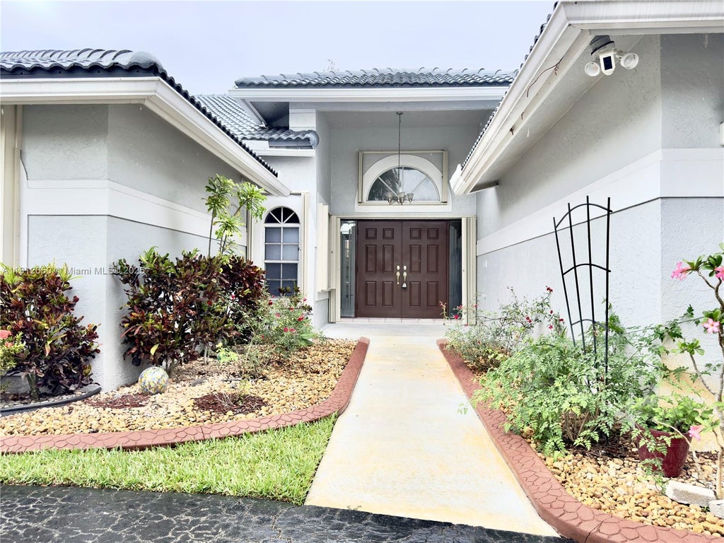 Photo of 5136 NW 99th Way, Coral Springs, FL 33076 (MLS # A11812050)