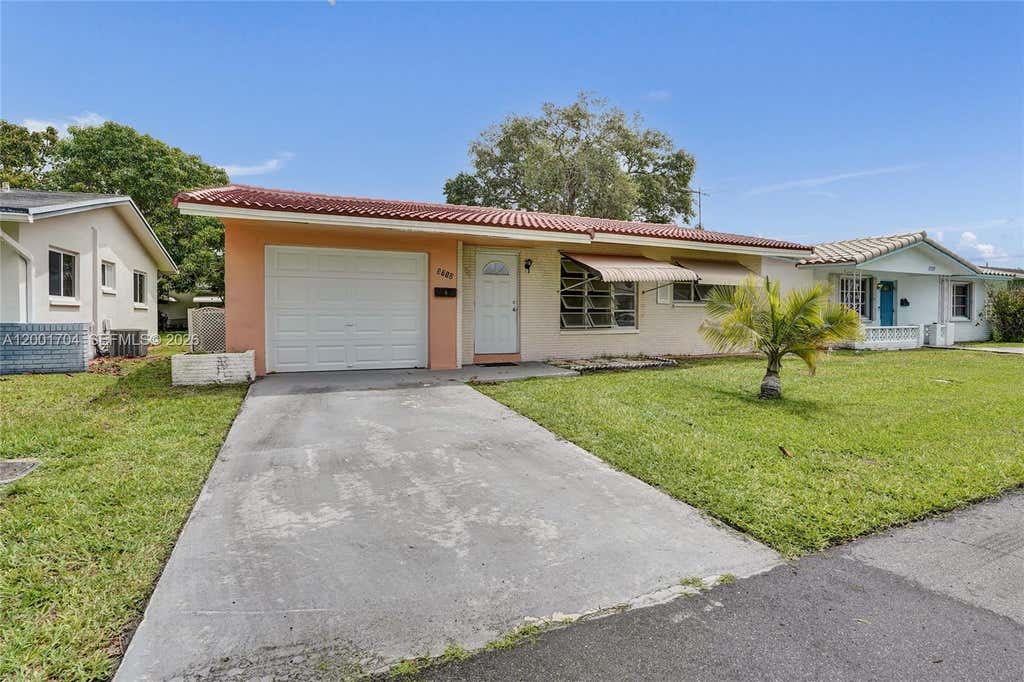 Photo of 5712 NW 66th Ave, Tamarac, FL 33321 (MLS # A12001704)