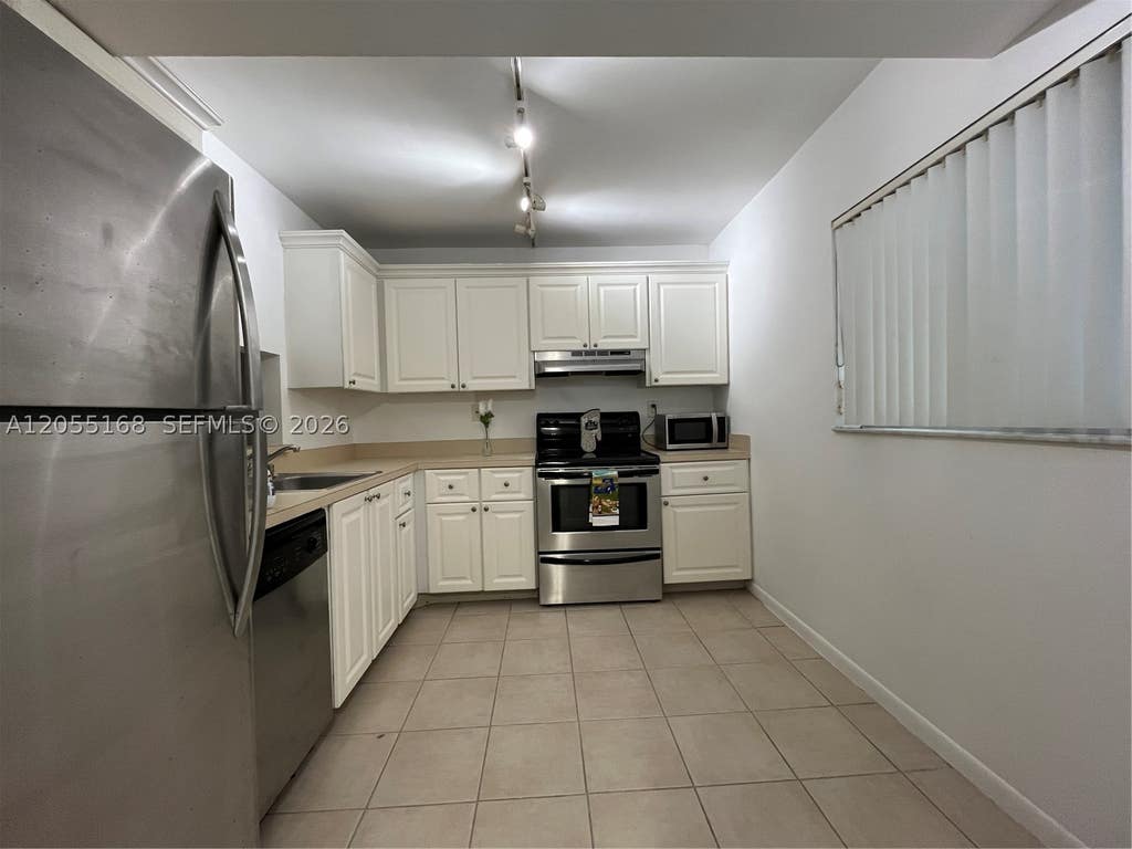 Photo of 701 N Pine Island Rd #202, Plantation, FL 33324 (MLS # A12055168)