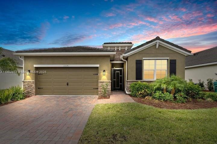 Waterfront luxury in The Estates at Tradition! This 2021 CBS smart home features 4 bedrooms, 2 bathrooms, 2-car garage, and a screened-in patio perfect for sunsets. Energy-efficient with keypad entry, garage remotes, concrete tile roof, paver driveway, and mature landscaping with irrigation. Open floor plan with volume ceilings, spacious kitchen with granite counters, breakfast bar, stainless steel appliances, and pantry. Owners’ suite with dual vanities, separate shower, and 2 walk-in closets. Gated community with clubhouse, pool, lawn maintenance & cable included. Minutes from shops, dining, I-95 & hospitals.