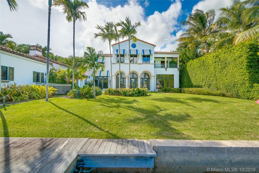 Impressive Italian Villa designed by architect Peter Hawrylewicz. Built in 2002 on a 17,500 SF lot w/100' of open water views. IPE dock, manicured landscaping, large outdoor pavilion w/fireplace, separate guest house w/cabana bath & 2-car garage complimen t this 6,827 SF Villa. Home features: UV treated impact doors/windows, Saturnia & wood floors throughout, groin vault & pecky cypress ceilings, chef's kitchen w/island, huge master suite w/Jacuzzi, private terrace & large walk-in closet.
