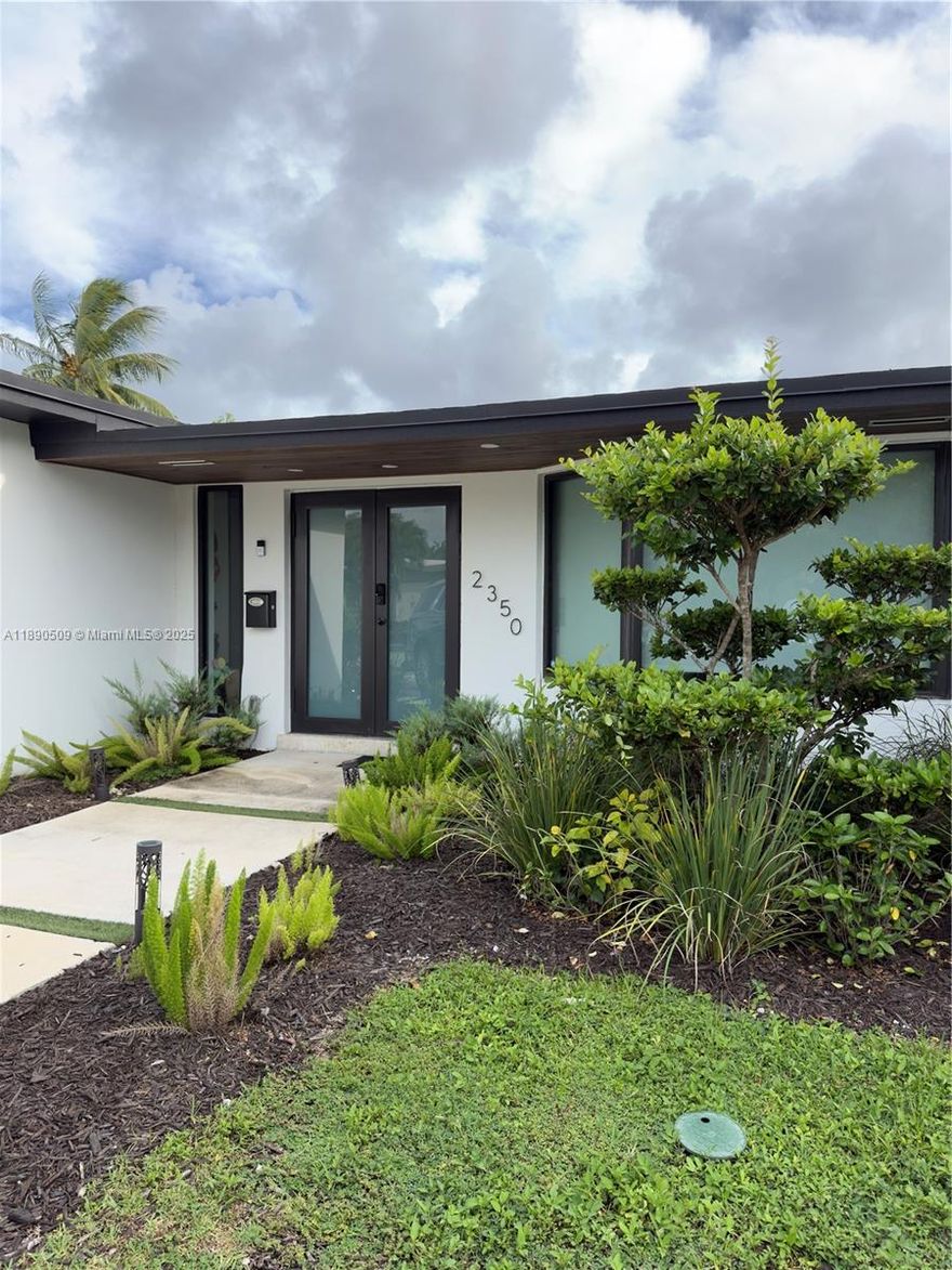 Welcome to this stunning 4-bedroom, 4-bath modern home nestled in a desirable family-friendly community with no HOA! Fully renovated with top-of-the-line finishes, this residence offers the perfect blend of luxury and comfort. Enjoy a bright open-concept layout, a custom kitchen, and a convenient laundry niche. Step outside to your private oasis with a sparkling pool and tranquil canal views. Ideally located near main highways, Aventura Mall, and top-rated public and private schools—this move-in ready home truly has it all!