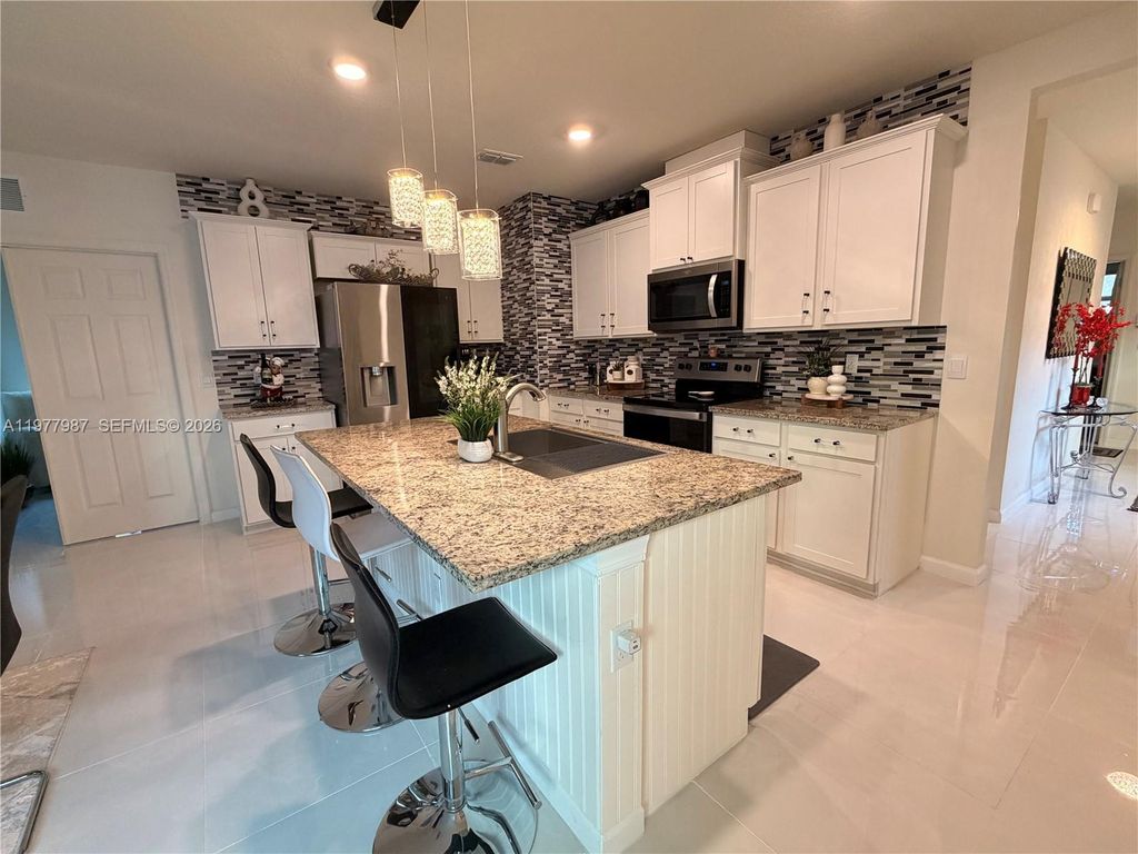 Photo of 12422 SW Rimini Way, Port St Lucie, FL 34987 (MLS # A11977987)