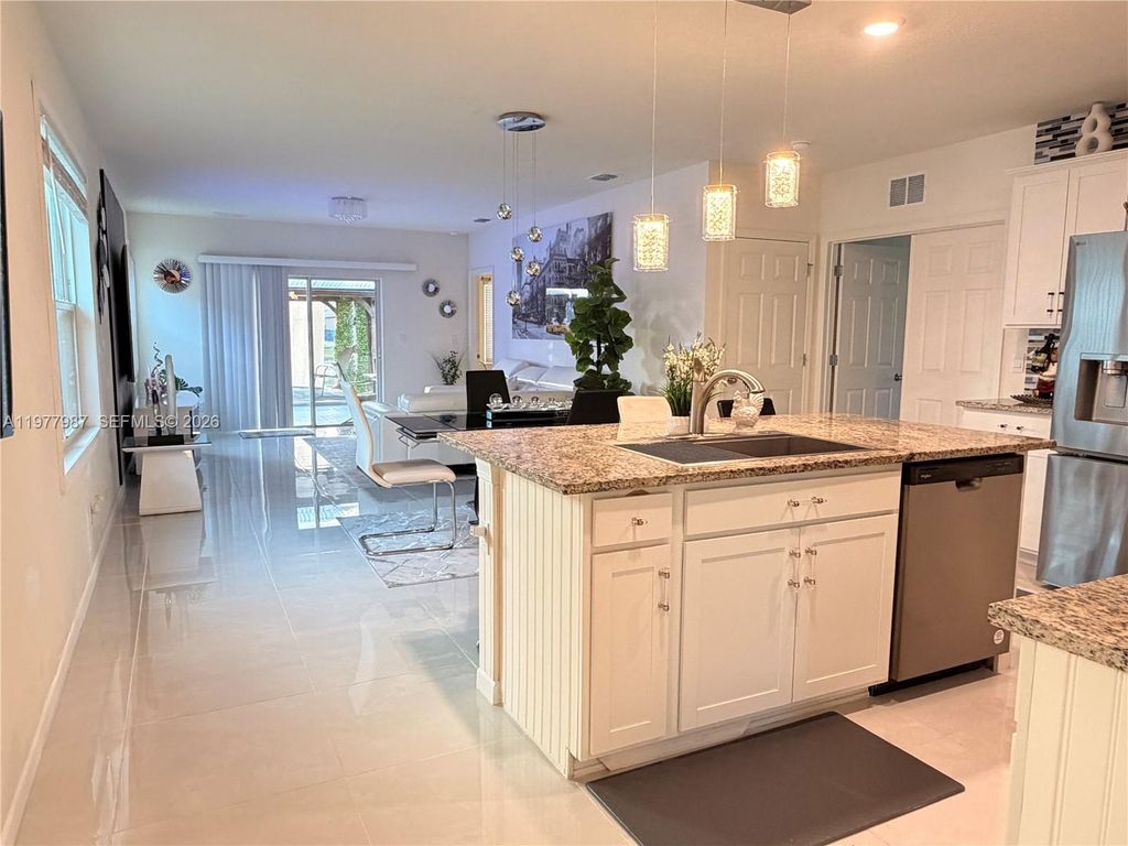 Photo of 12422 SW Rimini Way, Port St Lucie, FL 34987 (MLS # A11977987)