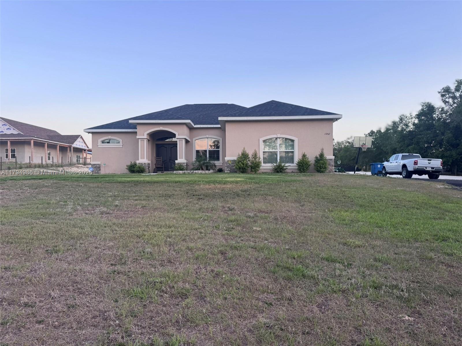 THE NEIGHBORHOOD IS PIGEON & LIVESTOCK FRIENDLY!!! Check out this stunning brand new build sitting on 2.5 acres. To the right is the beautiful kitchen with stainless steel appliances, cherry wood cabinets, and a breakfast nook to the right of the kitchen. Enjoy your very large primary bedroom with sliding glass doors entering to the lanai for a relaxing morning or afternoon. Alongside your primary bedroom is the primary bathroom including dual sinks, a linen closet, and an impressive walk in shower with dual faucets. On the other side of the home is your roomy living room with 2 guests bedrooms on each side. The guest bath is a shower/tub combo with LED lighting and a door leading to the backyard.