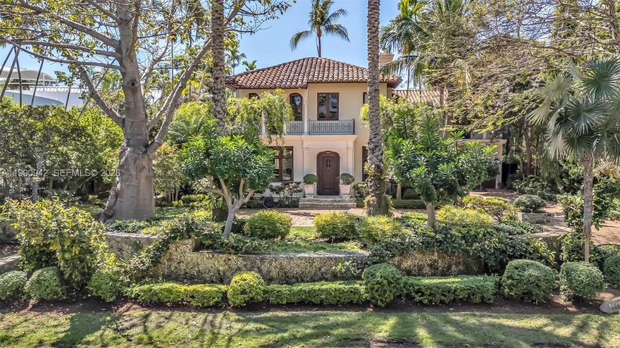 ***4,558 SF per appraisal **** A truly extraordinary family home in Coconut Grove's outstanding Moorings community — one of only two Miami neighborhoods with private roads and a 24-hour manned guard gate. Abundant common areas, including the iconic 100-year-old Kapok tree at the entrance, reflect the unique and historic character of this community.  
Set atop the Coconut Grove Bluff at approximately 18 feet above sea level, the home features timeless Mediterranean architecture, lush landscaping, and exceptional curb appeal. Interiors provide warm, natural light, beautifully designed windows, original Cuban tile floors, and elegant architectural details throughout. Sun-filled sitting rooms overlook the gardens, creating bright living spaces great for both family living and entertaining.
.