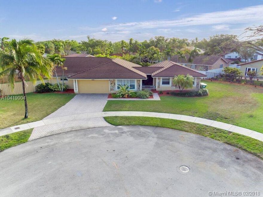 This spacious home is nestled in a quiet cul-de-sac with plenty of space for your boat and RV. Centrally located, this property checks off all your wants. Seconds from the Turnpike, A schools, close to shopping malls and restaurants but yet very private and in a extremely desirable location. This split plan design is tiled thru out with three air conditioning units for high energy saving, new roof, two car garage, stainless steel appliances and pool surrounded with pavers for easy maintenance. The extended back patio terrace offers plenty of room for entertaining and relaxation.