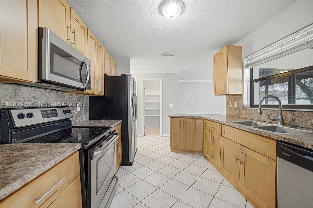 Photo of 1454 SW 26th Ave, Deerfield Beach, FL 33442 (MLS # A12092790)