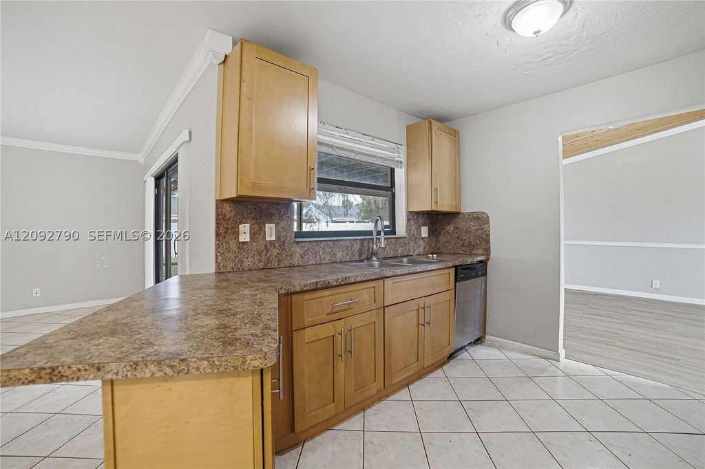 Photo of 1454 SW 26th Ave, Deerfield Beach, FL 33442 (MLS # A12092790)
