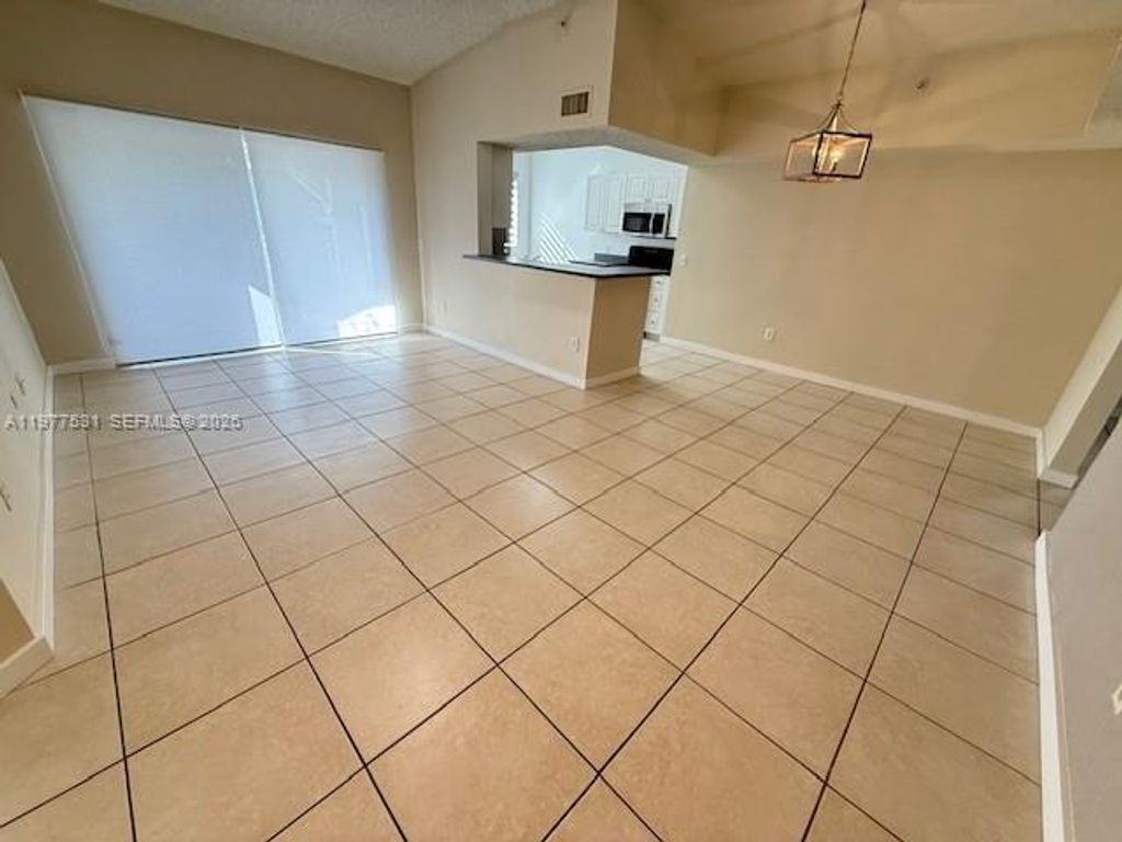Photo of 150 NW 96th Ave #9-302, Pembroke Pines, FL 33024 (MLS # A11977531)
