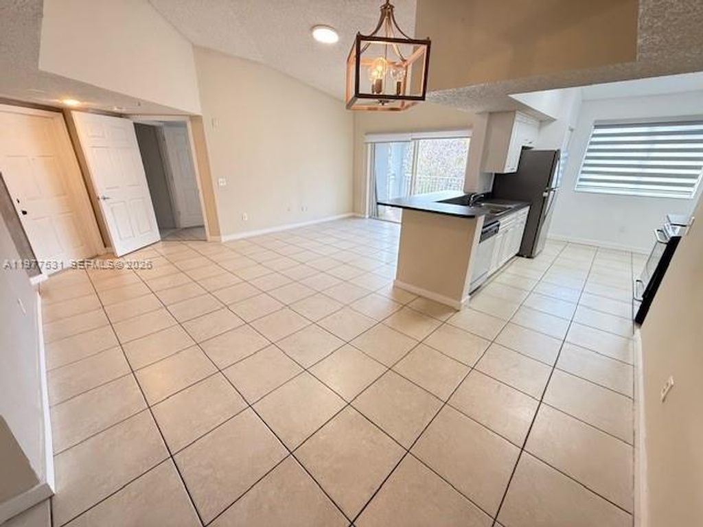 Photo of 150 NW 96th Ave #9-302, Pembroke Pines, FL 33024 (MLS # A11977531)