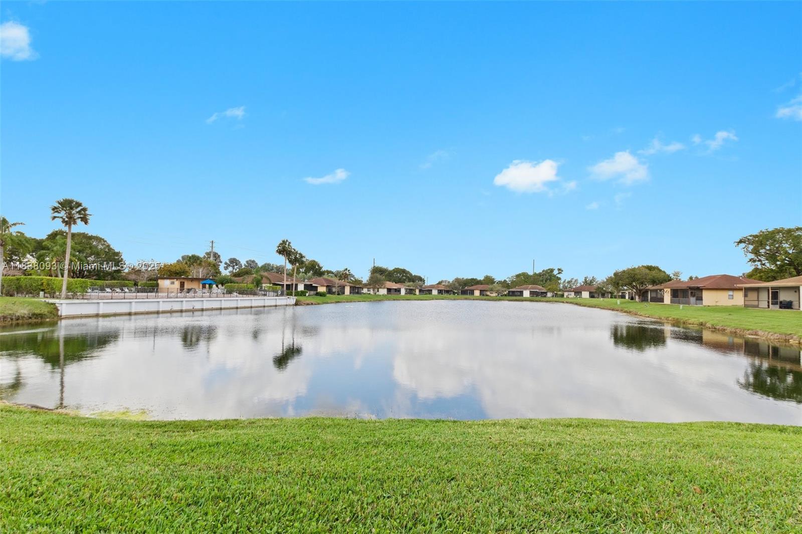 LAKEFRONT VILLA. Washer/Dryer in unit. Extra storage. Brand new paint, updated bathrooms, and tile flooring throughout highlight this 3-bedroom villa on the lake. Enjoy low-maintenance living with picturesque water views, lawn care included This move-in ready property offers a comfortable and stylish retreat in a desirable lakeside setting."