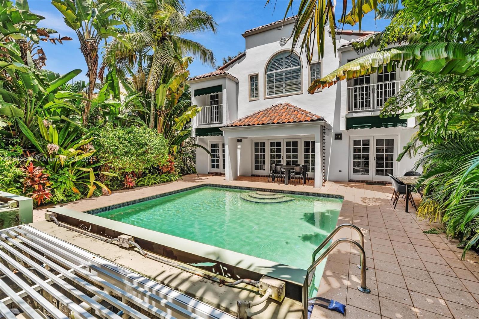 Welcome to 2516 San Domingo Street, a beautifully appointed 4-bedroom, 3-bath pool home nestled in the heart of prestigious Coral Gables. Located just a short stroll from the iconic Biltmore Hotel, this residence offers the perfect blend of elegance, comfort, and lifestyle. Featuring an open floor plan with two expansive family rooms, the home is ideal for both relaxed living and stylish entertaining. Soaring ceilings and large windows flood the interiors with natural light and provide serene views of the lush tropical landscaping that surrounds the private pool area.Enjoy the convenience of two separate car garages, and unwind in your own tranquil outdoor oasis. Live the Coral Gables lifestyle—tree-lined streets, fine dining, golf, tennis, and cultural landmarks—all just moments away.