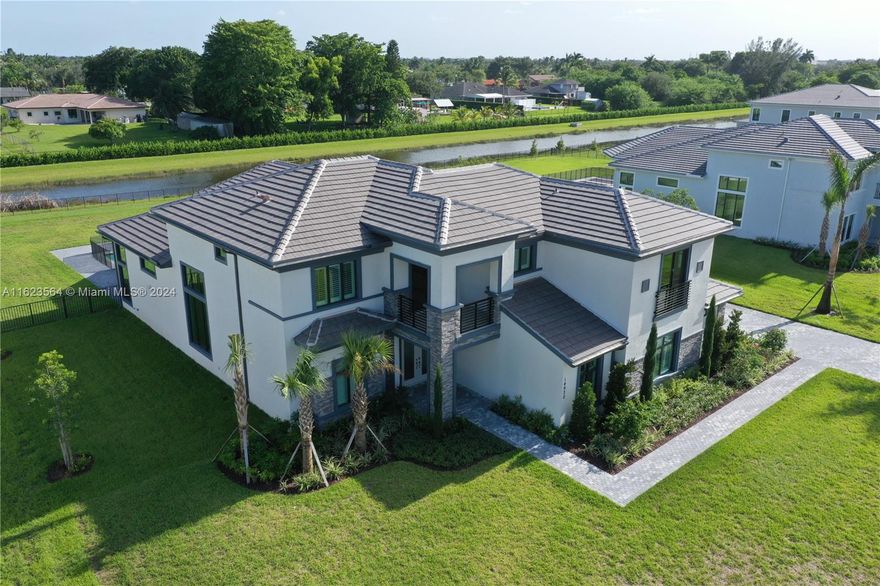 BRAND NEW estate at the New Gated Community, Millstone Ranches in Davie, FL. Built by the renowned Toll Brothers in 2024, this home has never been occupied. With over $400k in upgrades this elegant and contemporary 5 bed, 5.5 bath, 4 car garage home has it all! Sitting on .83 acres, the home has a long paver driveway that leads to the side entrance garage. Lush upgraded landscaping, landscape lighting and a completely fenced-in backyard give you privacy and safety. Upgrades- Engineered wood floors,coffered ceilings,crown mldg,salt/heated pool with child fence and sun shelf,humidistat,oak stairs w/wrought iron rails,$20k electrical upgrades,upgraded countertops/entry doors/cabinets/closet systems/faucets/fixtures/shower enclosures. Office with Double French Doors,Impact Windows/Doors,Alarm.