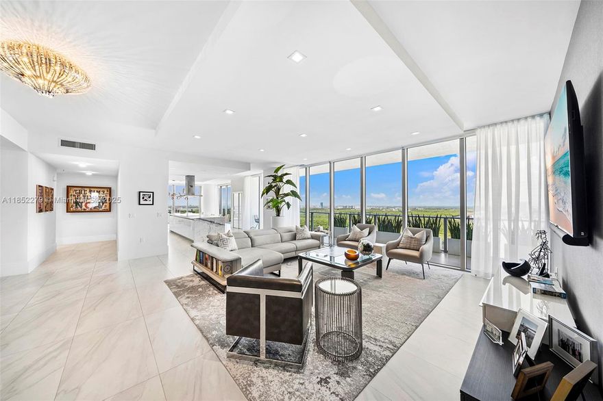 Welcome to the top of the world - Penthouse 1 at Parque Towers, where sky, city, and ocean collide in full panoramic glory. Designed by Sieger Suarez and developed by J. Milton & Associates, this showpiece soars above Sunny Isles with floor-to-ceiling glass and views that stretch from downtown Miami to Fort Lauderdale and across the Atlantic. Every room is oversized, every finish flawless. The chef’s kitchen faces the Intracoastal, the primary suite stuns, and a balcony wraps the full length of the tower. Steps from the ocean, in the heart of it all - this is South Florida at its most spectacular.