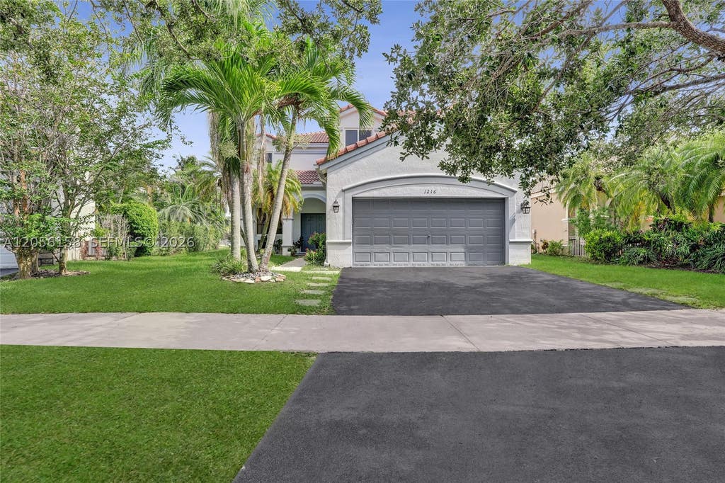 Photo of 1216 Chinaberry Dr, Weston, FL 33327 (MLS # A12056158)