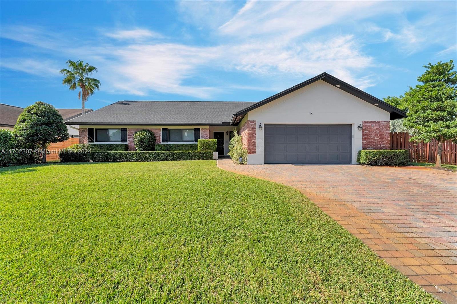 Experience the charm of this stunning farmhouse home. You'll be welcomed by its captivating curb appeal & a newer roof that from 2019. As you enter the home has cedar vaulted ceilings that enhance the spacious open floor plan, while large impact windows showcase natural light & highlight the pool & gardens in the home. The primary suite comes with double sinks, dual shower heads, & direct access to the pool area. Each room features custom closet furniture & blackout shades. The kitchen is a chef's dream, offering storage & multiple prep surfaces, making it the heart of this home. Step outside to discover a brand new tiki hut surrounded by serene zen gardens—ideal for family gatherings and entertaining. This home is a perfect blend of comfort and style, ready to welcome your family