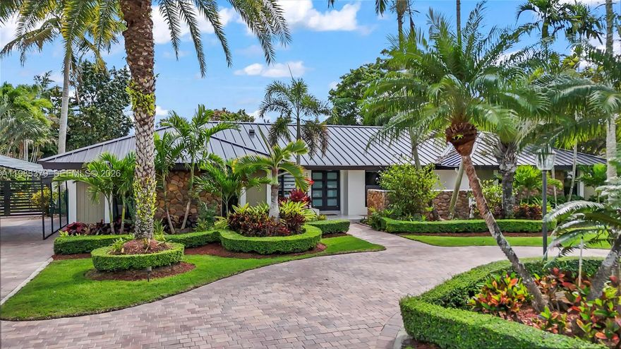 Absolutely stunning home situated on an expansive nearly 20,000 SF lot in desirable unincorporated Miami-Dade. This meticulously maintained property features a new roof, impact windows and doors, and an air conditioner less than one year old.

The spacious interior offers a beautifully designed kitchen that overlooks the entire backyard, creating the perfect setting for both entertaining and everyday living.

Step outside to your private tropical oasis featuring professionally designed landscaping, elegant lighting throughout the front and backyard, and a full sprinkler system to keep the grounds lush year-round. The backyard includes mature tropical fruit trees such as mango, mamey, and sapote, adding both beauty and the true South Florida lifestyle.

The property also features attractive pavers in the front and back, a separate pool house, and a cabana bath for convenience. The large swimming pool is approximately 10 feet deep, ideal for accommodating a diving board or trampoline, making it perfect for recreation and entertaining.

Located near top-rated A-rated schools from elementary through high school, this home also benefits from the lower tax base of unincorporated Miami-Dade.