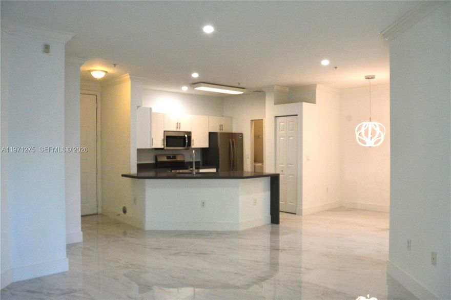 Welcome to this thoughtfully updated 2 bedroom, 2 bathroom residence with a brand new kitchen, modern cabinetry, new stainless steel appliances, new flooring throughout, updated window treatments, and a brand new washer and dryer in the unit. The functional layout provides comfortable separation of bedrooms while maintaining an open and inviting living and dining area that flows seamlessly into the kitchen. Natural light enhances the fresh finishes, creating a clean and contemporary feel throughout. Comes with 1 assigned one car parking garage (9B). Residents of Villaggio Condominiums enjoy access to a community pool, fitness center, billiard room, indoor basketball court and well maintained grounds. Conveniently located near shopping, dining, parks, and major commuter routes, this condo offers both lifestyle and accessibility.