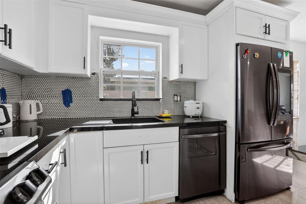 Photo of 681 NW 21st St, Pompano Beach, FL 33060 (MLS # A11995572)