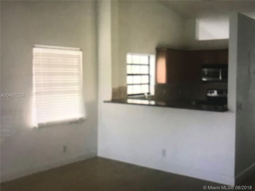 Beautiful corner unit 2/2 condo on the 2nd floor. It has an extra den/office and a lake view. Vaulted ceilings in the living area create an open and airy feel. Plantation windows in the master bedroom, new full size washer and A/C less than 3 yrs old. Resort like gated community features clubhouse, library, community pool, spa, tennis basketball, fitness center and more. Close to highways and beaches. Must see!