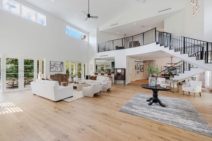 Newly built in 2021, this private Northeast Palmetto Bay estate offers seclusion, security, and seamless indoor-outdoor living. Located near top-rated schools and parks, it features high ceilings, wood floors, oversized windows, and a spacious primary suite with patio access. Enjoy a resort-style backyard with Pebble-Tec pool, basketball/pickleball court, and lush green space. Set on a 38,000 sq. ft. lot with 8,493 total sq. ft. of living space, including a 1,100 sq. ft. guest suite above a 3,000 sq. ft. garage. Flood Zone X with impact windows, doors, and a double-strapped roof.