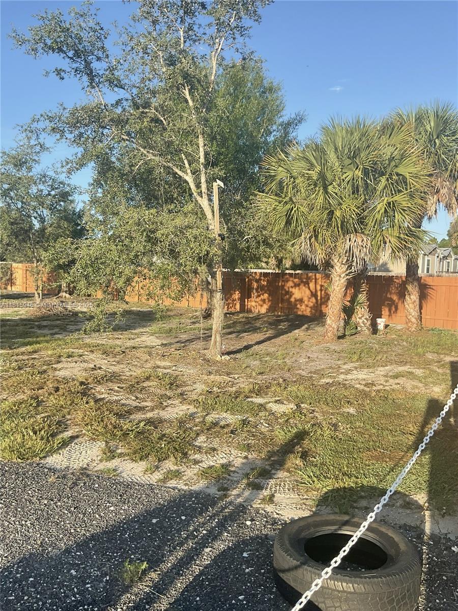 Opportunity knocks in Montura Ranches! This beautiful 1.25-acre corner lot is fully fenced with a brand-new wooden fence, and includes a paved driveway, private well, and gorgeous mature trees. Located in a thriving community surrounded by new custom homes, this clean, cleared lot is ready for your vision. Whether you're a family ready to build, an investor seeking growth, a builder looking for your next project, or a dreamer craving peaceful country living, this property delivers. No HOA and access to community clubhouse, pool, parks, and more. Secure your piece of Clewiston today!