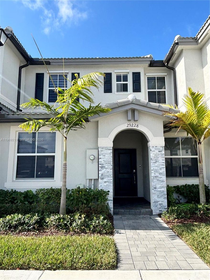 Welcome to this brand-new Townhome. Enjoy the open concept with abundant natural light and a charming patio, perfect for entertaining. This unit boasts 3 bedrooms and 3 full bathrooms, with ceramic flooring on the first floor and carpet on the second floor. One bedroom and one full bathroom are located on the first floor, ideal for guests or an office. The kitchen features a granite countertop, cooking island, and SS appliances. Just a few blocks from US1 and the Florida Turnpike, schools, supermarkets, putting you close to everything you need.  Two parking spaces right in front of the house and plenty of guest parking. Security is a priority Ring doorbell and alarm sensors. Ready to Move In. Easy to Show.