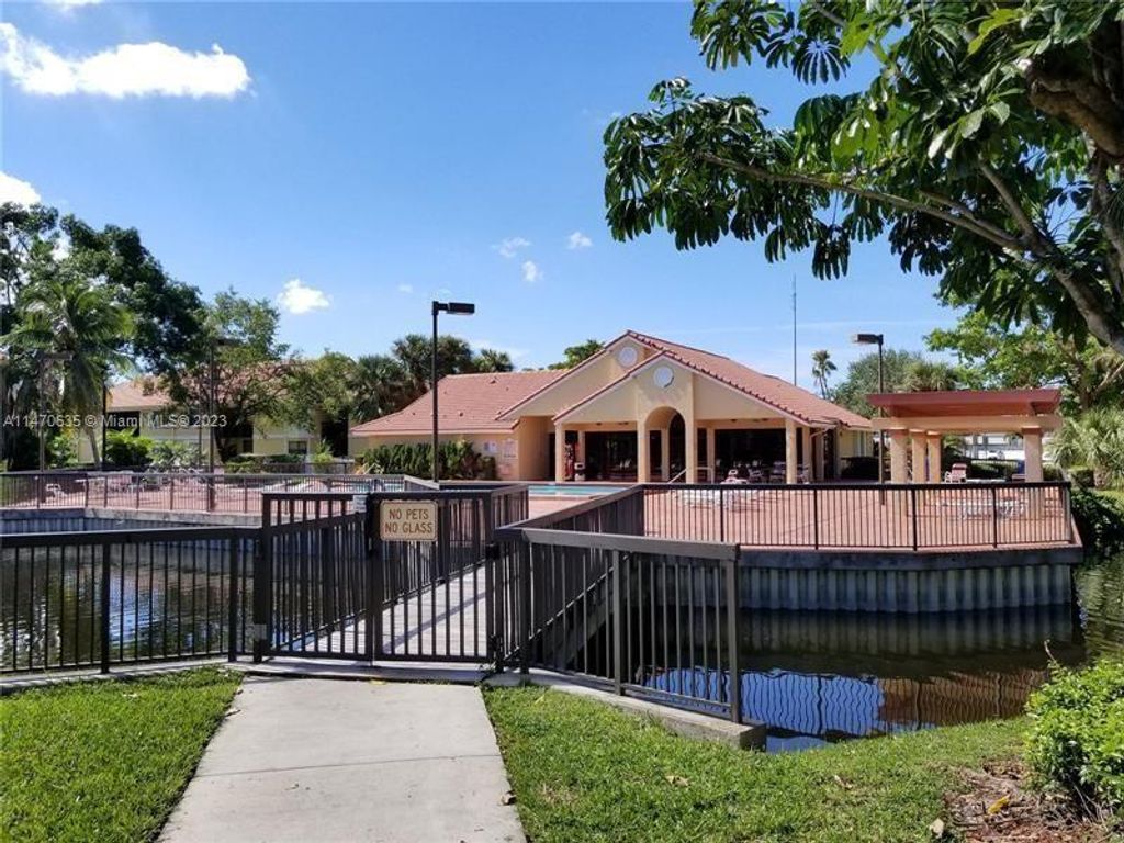 Photo of 5861 Riverside Dr #201A2, Coral Springs, FL 33067 (MLS # A11470635)