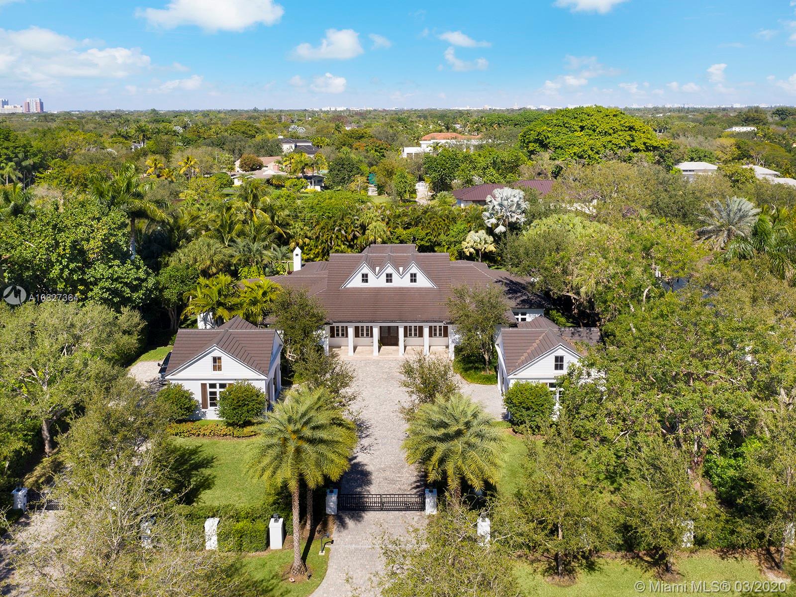 Recently custom-built, this 1 acre,low country style mansion is located in the heart of North Pinecrest.The home has 5 ground level bedrooms, all including en-suite bathrooms.This unique residence boasts a one of kind adult playroom, large open living areas, a his/hers office, wine cellar and a 4 car garage. The entire house is completed with top-of-the-line finishes and beautifully combines indoor and outdoor living with its enormous terraces, outdoor kitchen, gazebos, and expansive pool. The home is also equipped with the latest technology, making it a true smart house,and includes a safe room, gated driveway, generator, and concrete ceilings for additional security and storm protection. Just a short distance from all of South Miami’s, and Coral Gables’ schools, restaurants, and shops.