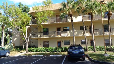Photo of 6085 N Sabal Palm Blvd #204, Tamarac, FL 33319 (MLS # A11619085)