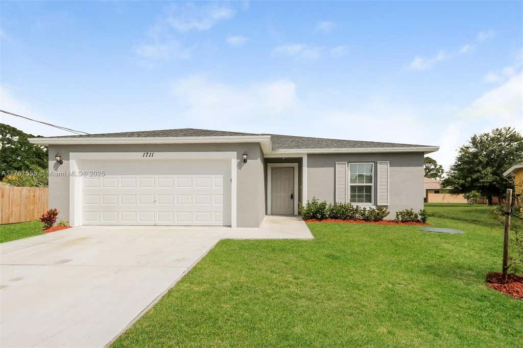 Photo of 1711 SW Bismarck St, Port Saint Lucie, FL 34953 (MLS # A11761555)