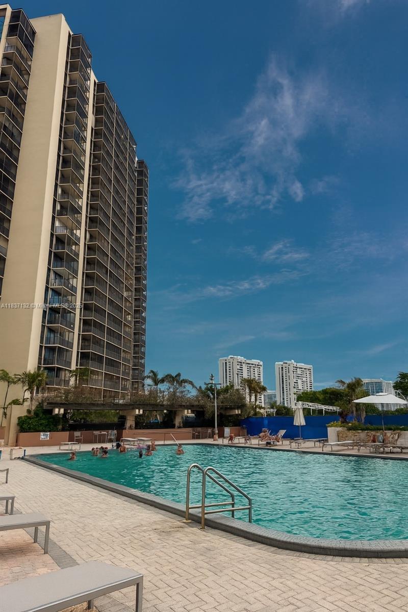 A brilliantly refreshed 2 bedroom, 2-bathroom corner unit offering panoramic views—from morning light to vibrant cityscapes visible through brand-new, permit-approved hurricane proof windows. This fully renovated apartment blends luxury and compliance, with every upgrade executed under valid permits. The open concept living and dining area flows seamlessly into a stylish kitchen featuring contemporary finishes. Located in a gated, recently remodeled building, the community offers enhanced security with 24/7 guard service, ensuring peace of mind. Convenience is paramount: you're just steps from the mall, grocery stores, and major freeways—ideal for commuters and shoppers alike. With high-end finishes, abundant natural light, and prime location, this unit is a perfect urban sanctuary.