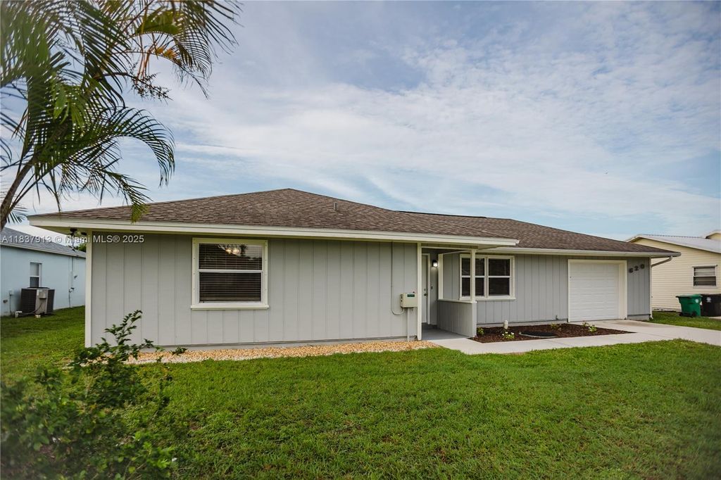 Photo of 620 SE Picasso Ave, Port St Lucie, FL 34983 (MLS # A11837913)
