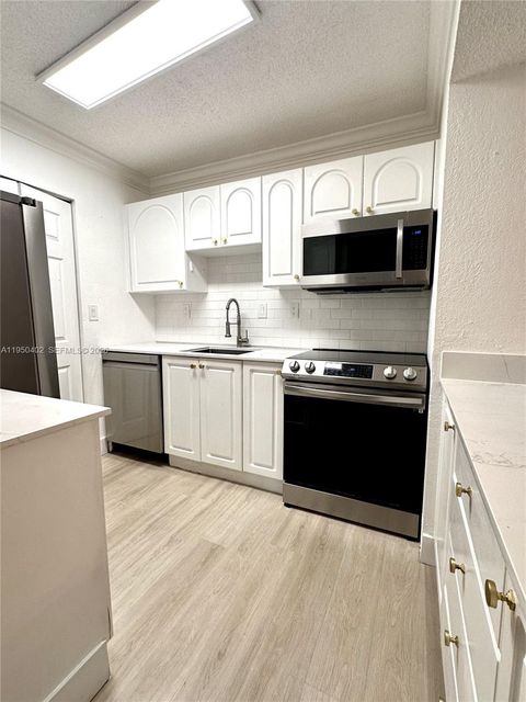 Photo of 10795 SW 108th Ave #304, Miami, FL 33176 (MLS # A11950402)