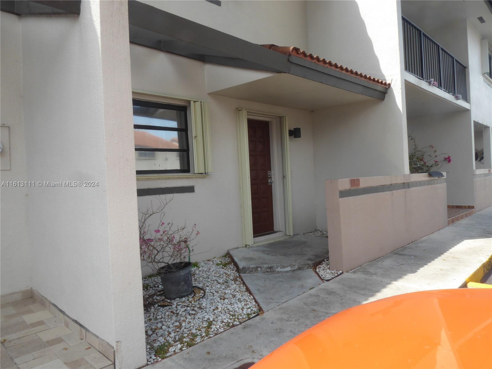 Spacious Lakefront townhouse in Lakeview, Rear patio with exterior laundry room. Tile floors downstairs and laminate flooring upstairs. Assigned parking space in front of unit. Plenty of guest parking. Accordion shutters throughout. Update this unit and make it your own! Pricing reflects updates needed.