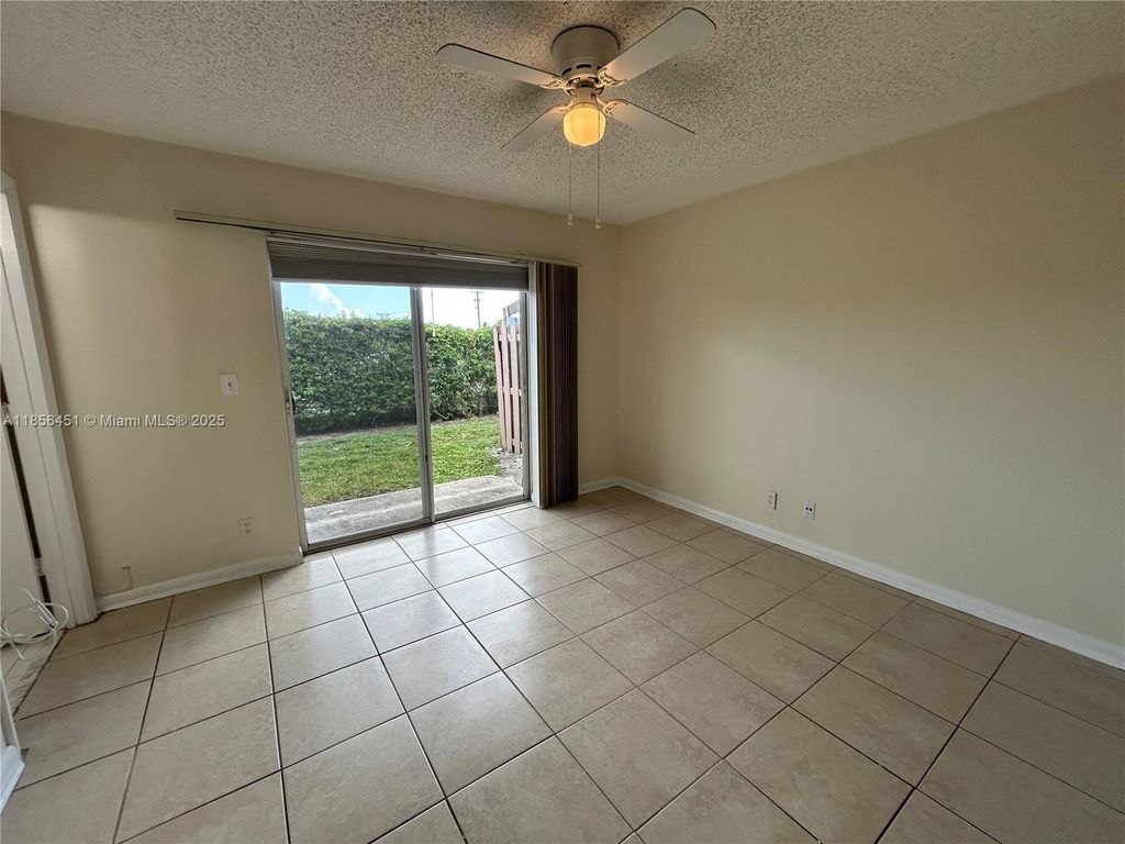 Photo of 910 E Cypress Way E, Palm Springs, FL 33406 (MLS # A11856451)