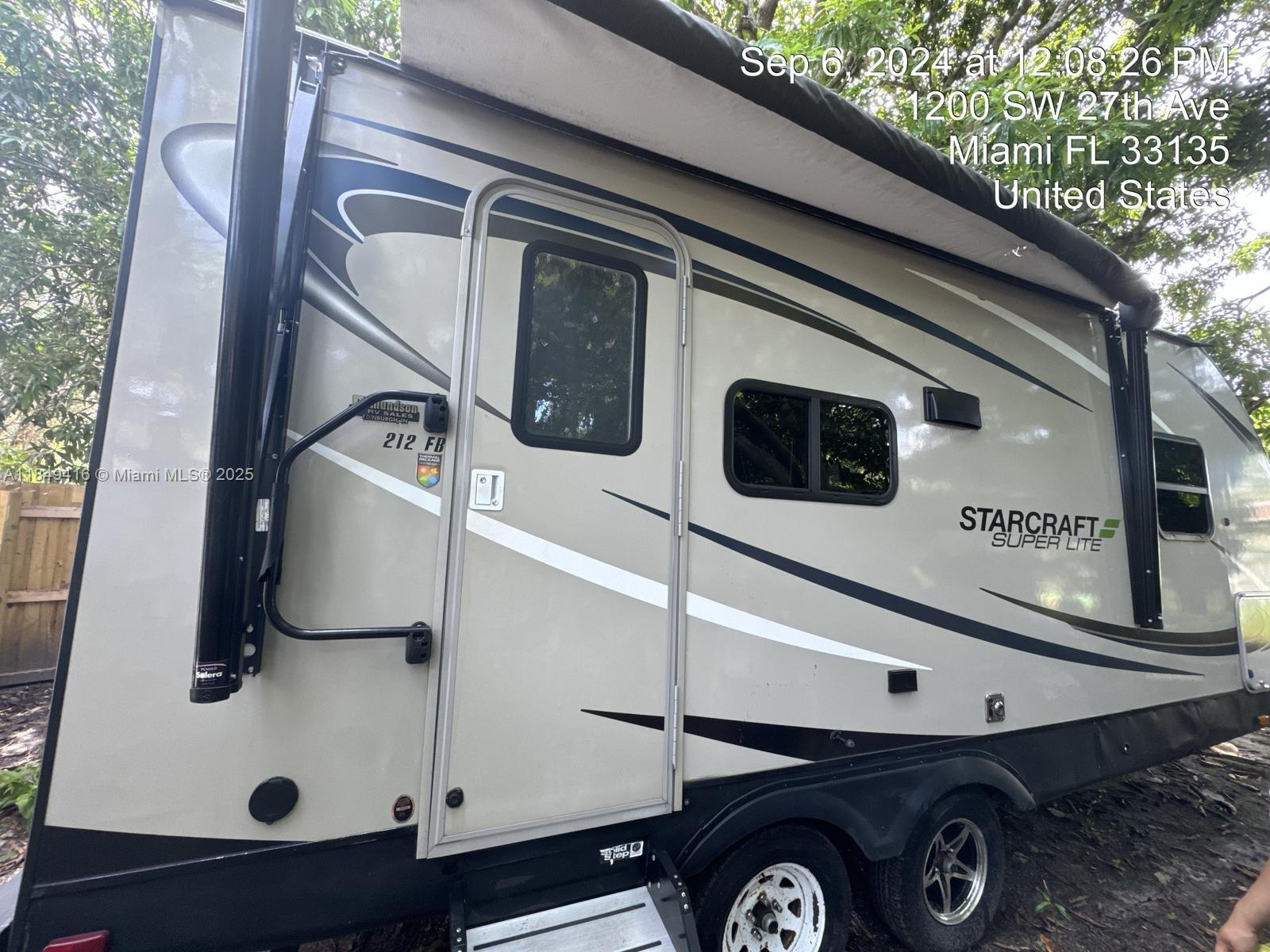 Unique rental opportunity! Modern Starcraft Super Lite 212FB RV parked in a quiet residential lot in the heart of Shenandoah. Offers a cozy and functional space with a queen bed, full bathroom, kitchenette, AC, and outdoor awning. Ideal for short- or long-term stays. Water, electricity, and internet included. Private entrance and steps away from Coral Gables, Brickell, and Coconut Grove. Easy approval. No HOA.