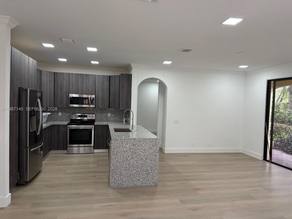 Photo of 1531 Passion Vine Cir #3-2, Weston, FL 33326 (MLS # A11987145)