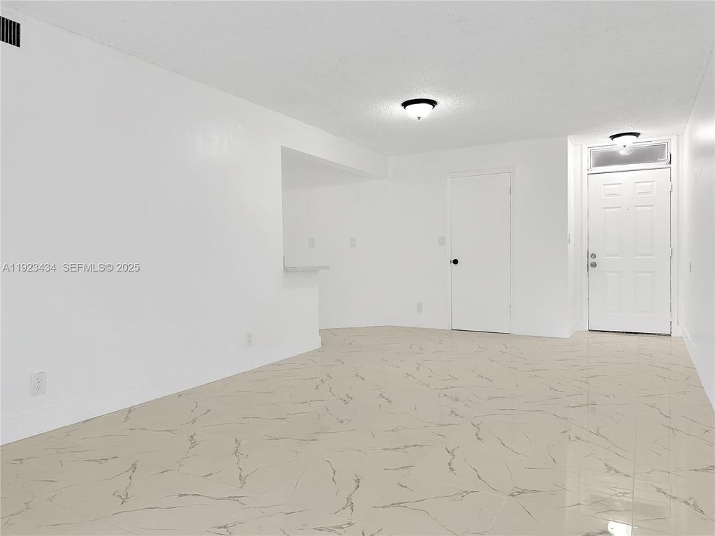 Photo of 211 Lake Pointe Dr #111, Oakland Park, FL 33309 (MLS # A11923434)