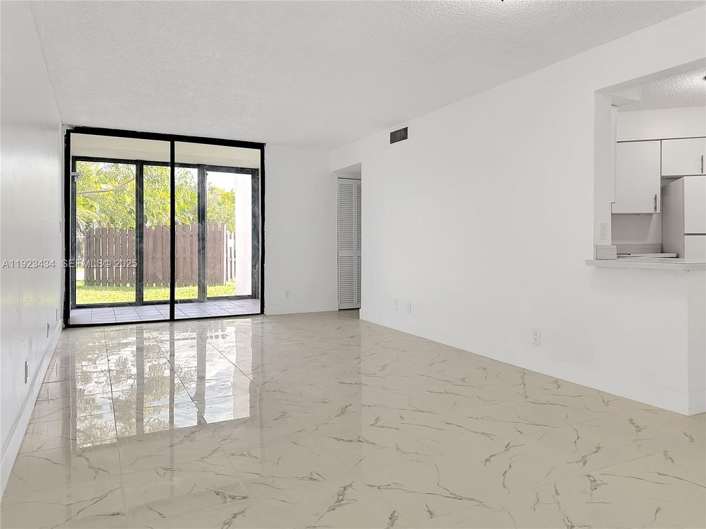 Photo of 211 Lake Pointe Dr #111, Oakland Park, FL 33309 (MLS # A11923434)