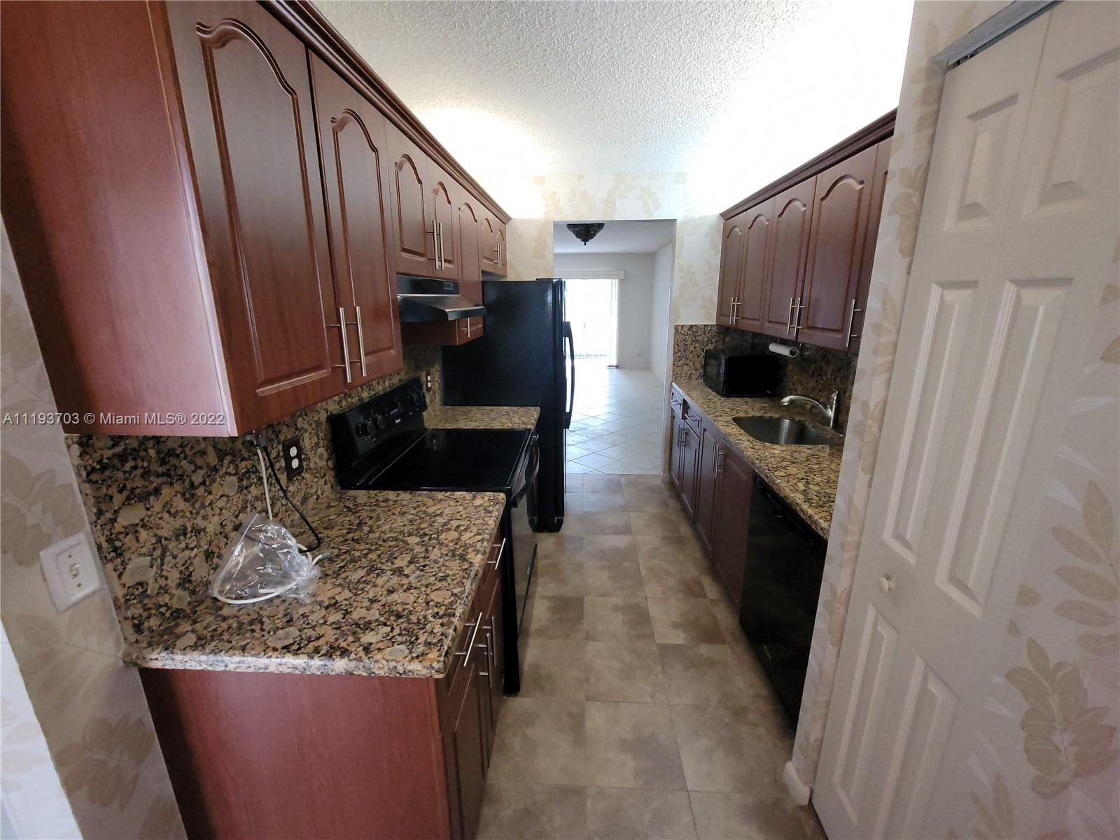 2 bedroom 2 bathroom with a breakfast nook and a galley kitchen that leads directly into the dining room. All tiles throughout the entire condo except for the bedrooms, which recently had new carpets installed. The unit is equipped with a washer and dryer inside. Hurricane accordion shutters all around. Feel secluded and at peace with complete privacy on the enclosed patio. This allows you the luxury to enjoy the outdoors while enjoying the nice cool air conditioner from the comfort of the patio. A peaceful view of the decorative and manicured landscaping. Eastern exposure view from the patio. Million-dollar clubhouse, bus transportation,2 fitness centers, 24 hr security, 8 swimming pools, tennis, movies, theater, billiards, pharmacy, cafe, golf, and much more.