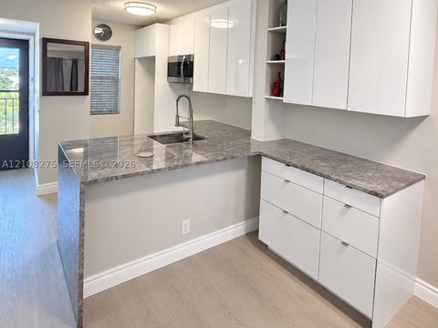 Photo of 2226 N Cypress Bend Dr #409, Pompano Beach, FL 33069 (MLS # A12108275)