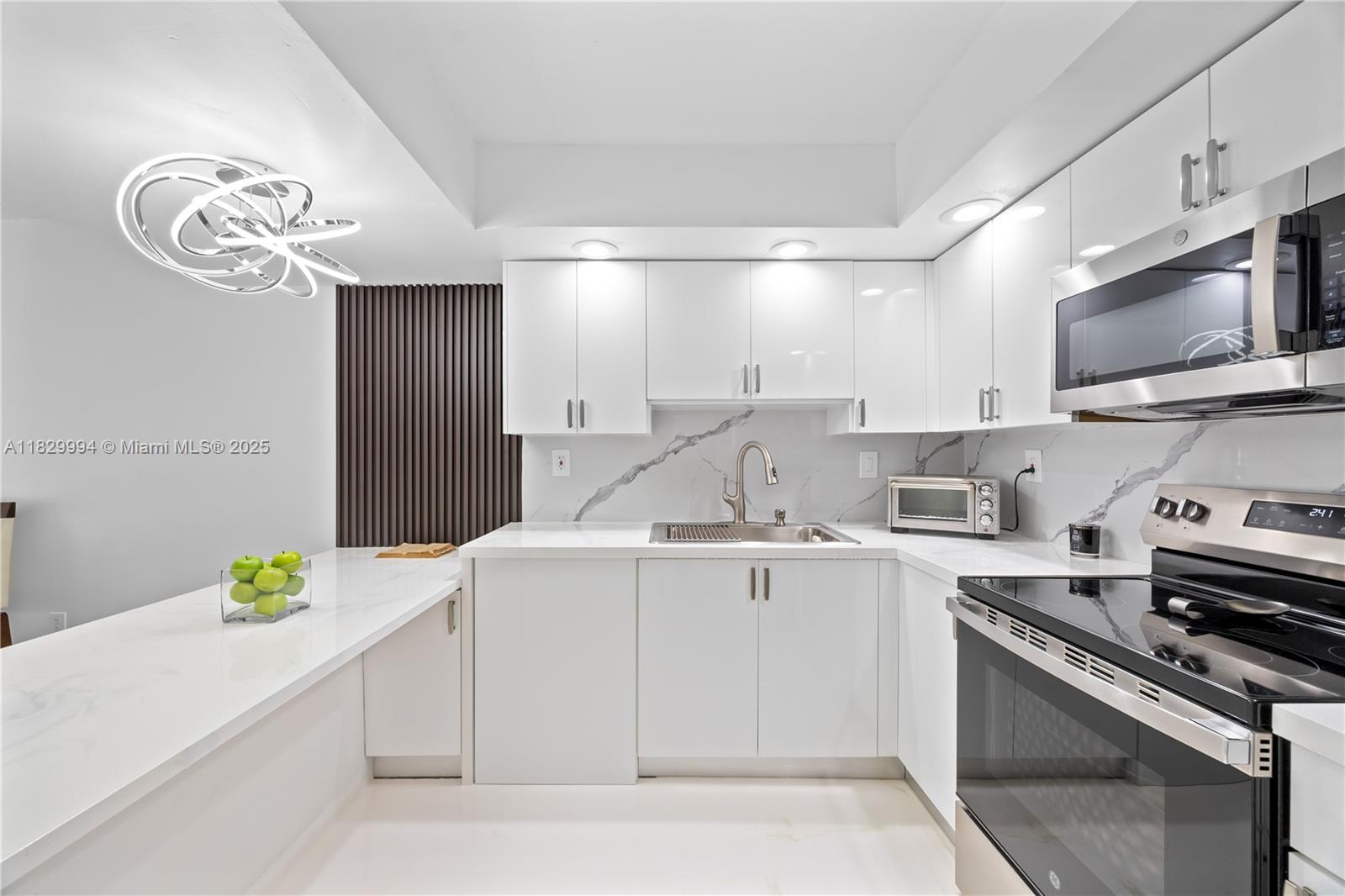 Absolutely beautiful, bright & spacious, ready to move in 3/2 ground floor unit in the famous Calusa Community on Kendall drive. Unit has a unique feature of 2 separate yards. One yard accessed from the Master bedroom that also has a separate entrance and the other yard from the other two rooms. Very tastefully decorated. Features include brand new kitchen with quartz countertops, brand-new S/S appliances, designer light fixture, Zebra blinds, renovated bathrooms with floating Vanities & Epoxy floors in the whole unit. Also has a laundry closet with a full-size Washer/Dryer. Conveniently located close to the malls, banks, supermarkets, and expressway. Community recently finished the 40-year inspection. Don't miss out on the opportunity of owning this spectacular unit in a great location.