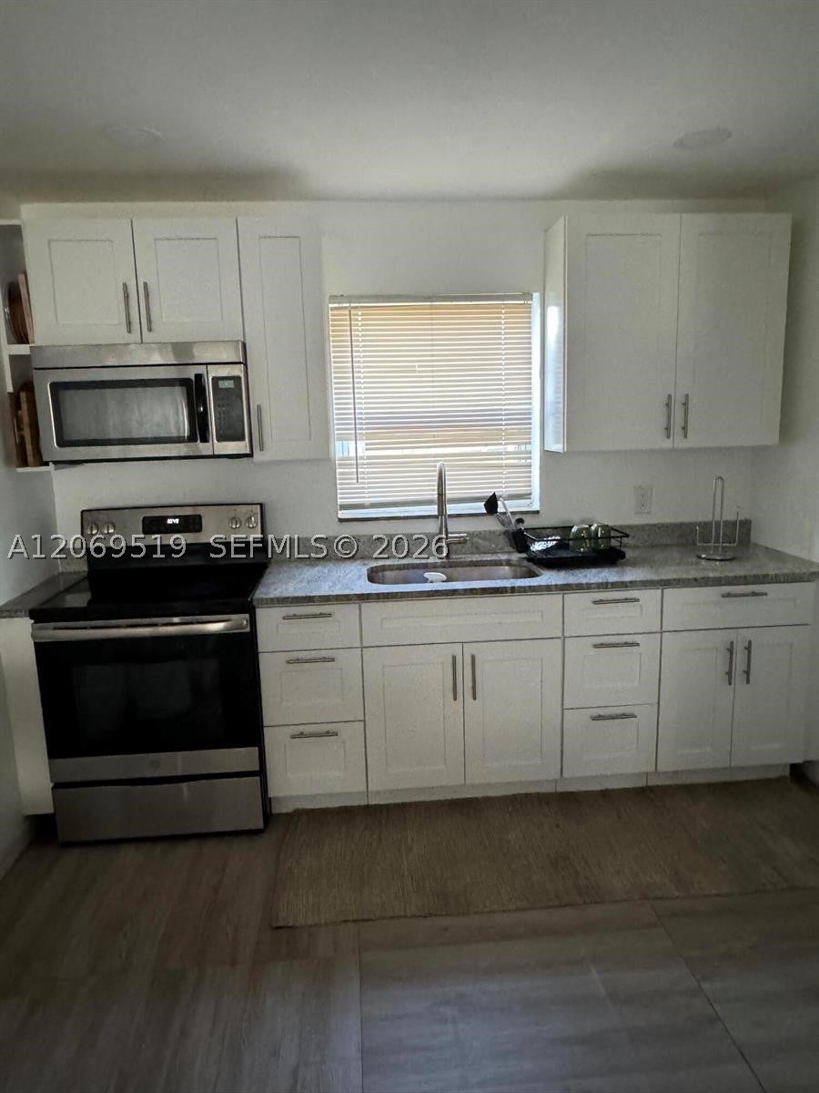 Photo of 1281 W 35th St, Riviera Beach, FL 33404 (MLS # A12069519)