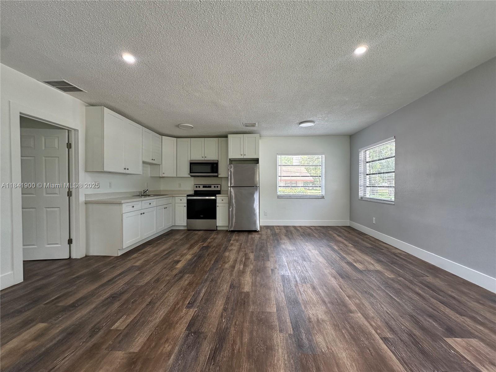 SPACIOUS, stunning and entirely remodeled!! 1-bedroom 1-bath, corner unit apartment in Edgewood - a quiet, charming neighborhood in Ft. Lauderdale. This cute unit is large and BRAND NEW - fully equipped with new lighting, flooring, stainless steel appliances, granite countertops, new cabinets + beautiful kitchen & bathroom finishes. Also features new central AC & impact windows. Water, waste, sewer & maintenance included. Located in a beautiful building with lots of privacy. Area is tranquil, nestled on a quiet street, close to great parks & recreation centers. Gorgeous community and well-maintained property with laundry facilities on-site & private parking for residents. Turn-key gem. A peaceful oasis in an excellent location! Close to major highways, airport, downtown Ft. Lauderdale etc.
